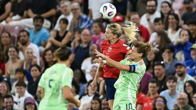 Italy's forward #10 Cristiana Girelli (R) fights for the ball with Norway's forward #14 Ada Hegerberg