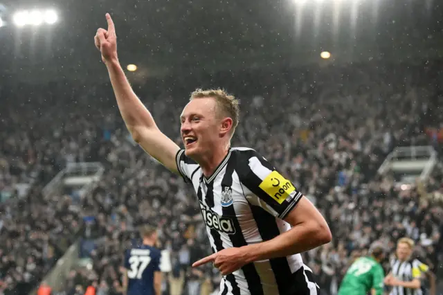 Sean Longstaff celebrates scoring for Newcastle against Paris St-Germain in 2023