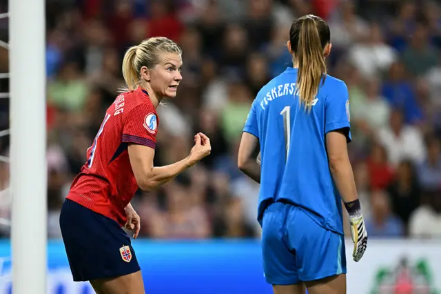 Ada Hegerberg reacts next to Norway's goalkeeper #01 Cecilie Fiskerstrand during the UEFA Women's Euro 2025 quarter-final football match between Norway and Italy at the Stade de Geneve in Geneva, on July 16, 2025.