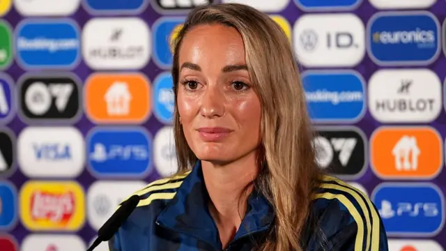 Asllani speaks to the media