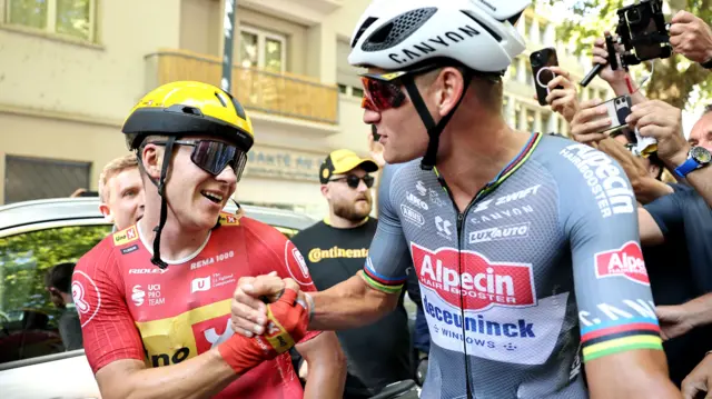 Jonas Abrahamsen is congratulated by Mathieu van der Poel]after winning stage 11 of the 2025 Tour de France