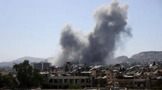 Smoke rises after strikes on Syria's defense ministry in Damascus, according to Al Jazeera TV, in Damascus, Syria July 16, 2025