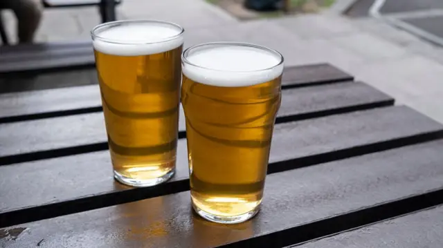Two pints on a table outside