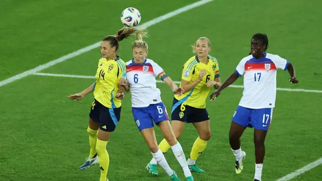 Leah Williamson of England challenges for a crossed ball with Nathalie Bjoern of Sweden