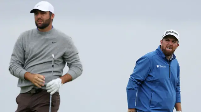 Scottie Scheffler and Shane Lowry look on during The Open at Royal Portrush