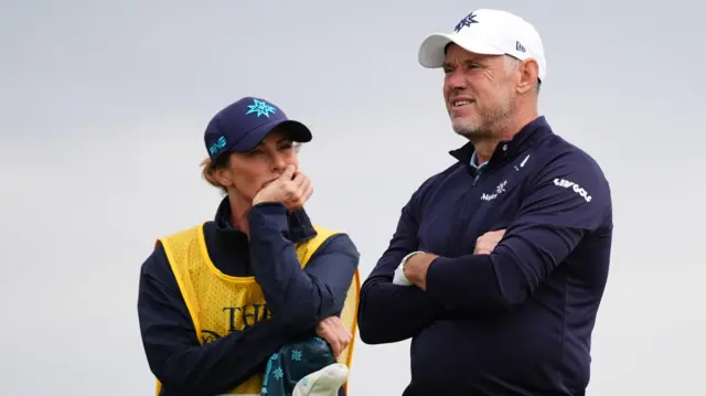 England's Lee Westwood with wife and caddie Helen Storey waiting on the 6th on day one of The 153rd Open Championship at Royal Portrush
