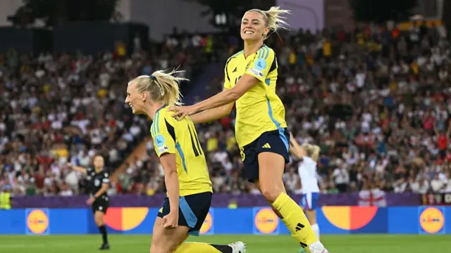 Sweden's forward #11 Stina Blackstenius celebrates with Sweden's forward #18 Fridolina Rolfo after she scored her team's second goal