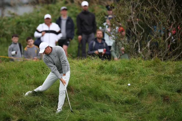 Rory McIlroy chips out of the rough