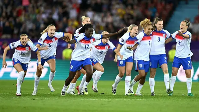 Chloe Kelly, England's defender #15 Esme Morgan, England's defender #05 Alex Greenwood, England's forward #17 Michelle Agyemang, England's forward #23 Alessia Russo, England's forward #07 Lauren James, England's defender #03 Niamh Charles and England's defender #02 Lucy Bronze celebrate at the end of the UEFA Women's Euro 2025 quarter-final football match between Sweden and England at Letzigrund Stadium in Zurich, on July 17, 2025. England won on penalties over sweden after extra time
