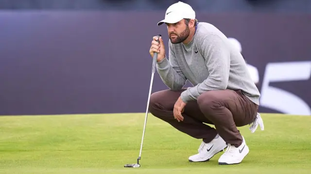 Scottie Scheffler lines up a putt at The Open Championship