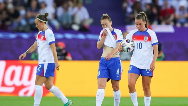 England players look dejected after conceding a second goal