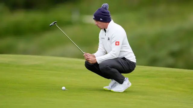 Matt Fitzpatrick lines up a putt at The Open Championship