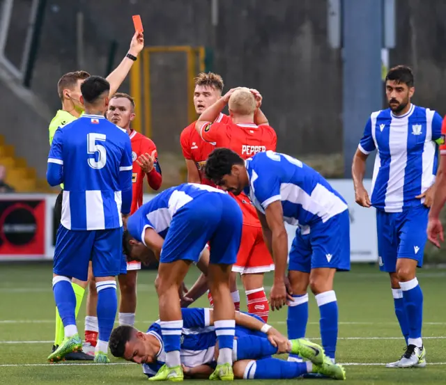 Odhran Casey is shown a red card