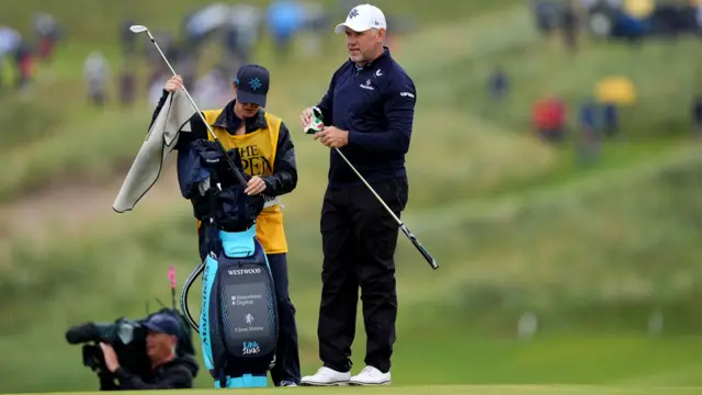 Lee Westwood holds a club during The Open Championship at Royal Portrush