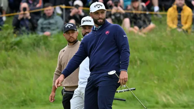 Schauffele, Spaun and Rahm look on during The Open