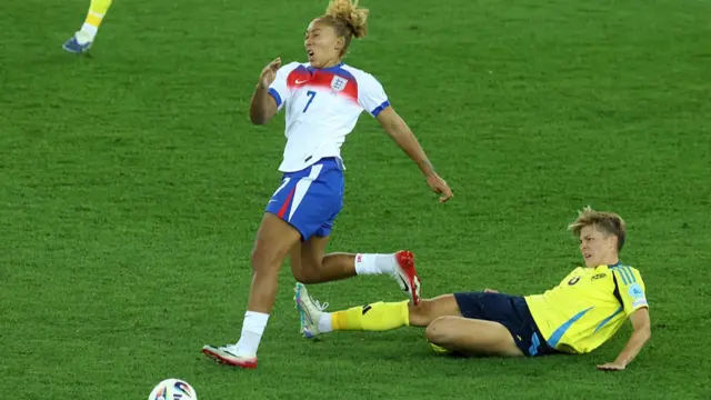 Lauren James of England is challenged by Lina Hurtig of Sweden