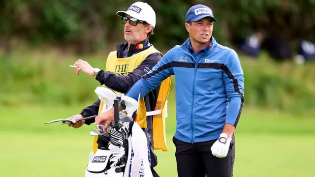 Viktor Hovland with his caddy at The Open Championship 2025