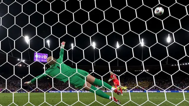 Sweden's goalkeeper Falk missing her penalty against England