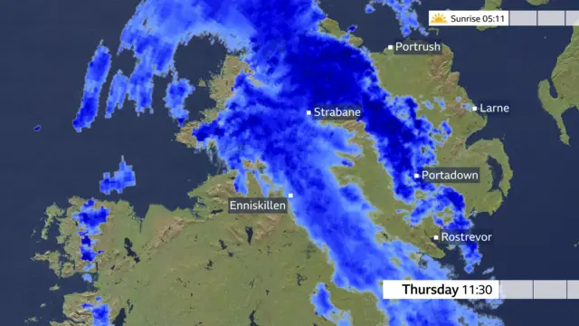 An image of rain sweeping across Northern Ireland but not on Portrush yet