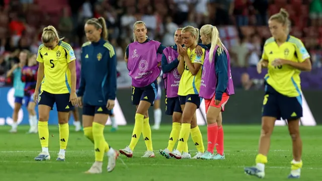 Smilla Holmberg of Sweden is consoled by team mates Jonna Andersson and Emma Holmgren after she misses the team's seventh penalty in the penalty shoot out