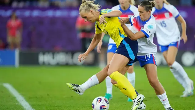Grace Clinton midfield of England and Manchester United and Emma Stina Blackstenius forward of Sweden and Arsenal FC compete for the ball