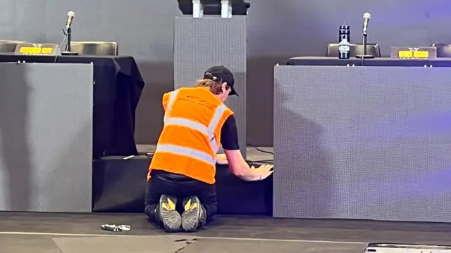 A man working on a stage
