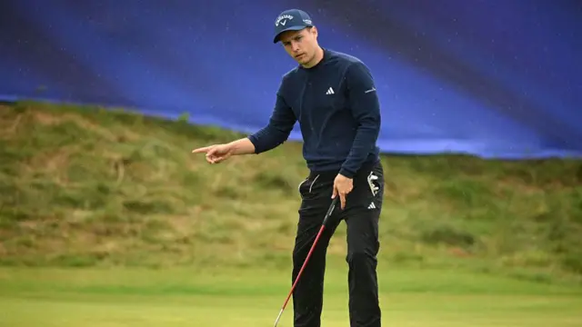 Matthew Jordan holds a putter on a green at The Open Championship