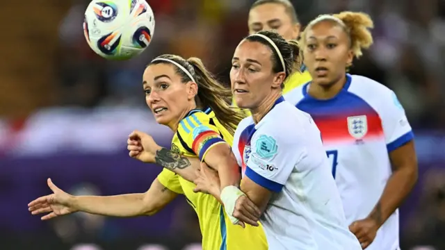 Sweden's forward #09 Kosovare Asllani fights for the ball with England's defender #02 Lucy Bronze