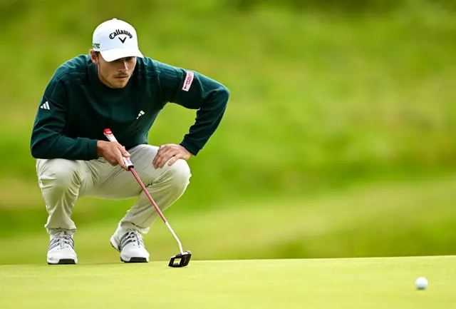 Nicolai Hojgaard putts at Royal Portrush for the 153rd Open Championship