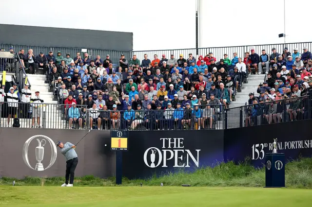 Crowds around the first tee