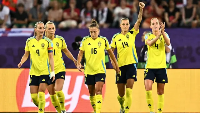Sweden's forward #11 Stina Blackstenius (2ndL) celebrates with teammates