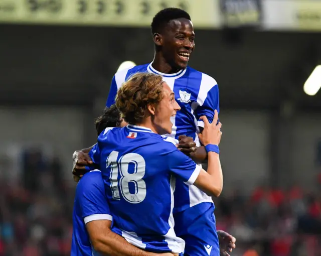 St Joseph's celebrate scoring a goal