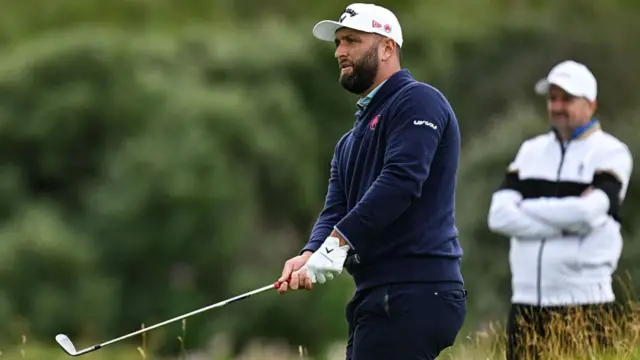 John Rahm chips during the 153rd Open Championship at Royal Portrush