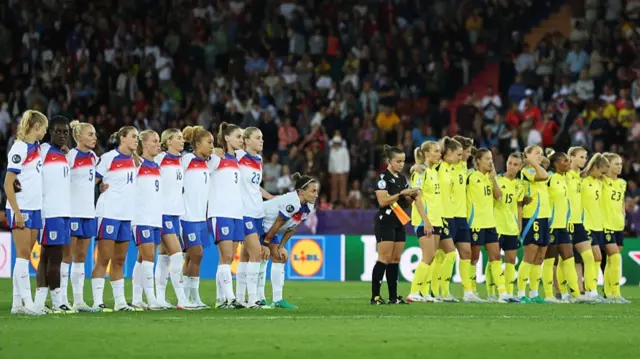 Players of Sweden line up ahead of the penalty shoot out