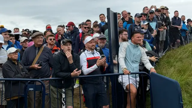 Fans trying to catch a glimpse of Rory McIlroy