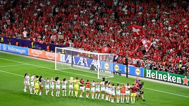 Switzerland players applauding their fans