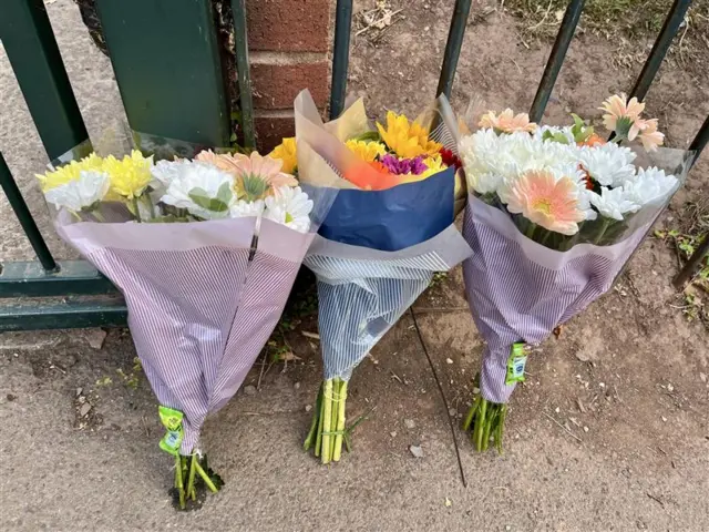 Floral tributes left outside Minehead Middle School after coach crash scene