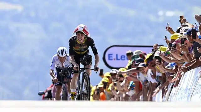 Jonas Vingegaard goes past Remco Evenepoel during stage 13 of the 2025 Tour de France