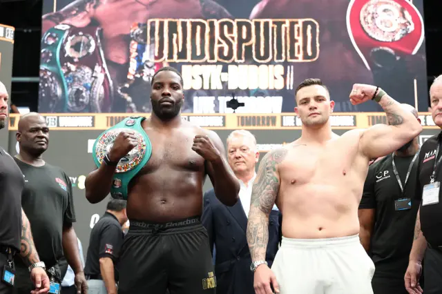 Lawrence Okolie and Kevin Lerena pose for pictures at a weigh-in