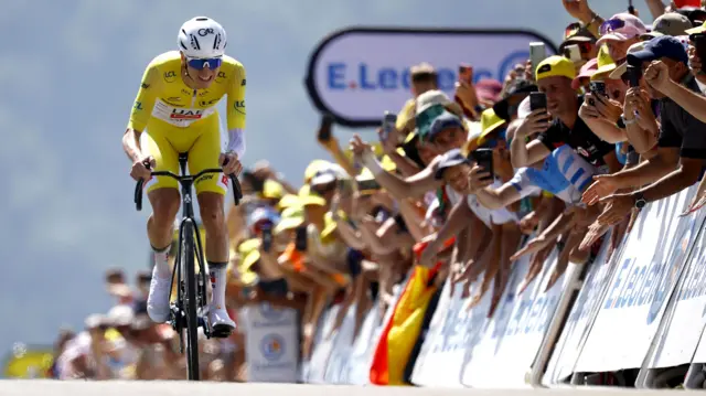 Tadej Pogacar approaches the finish line on stage 13 of the 2025 Tour de France