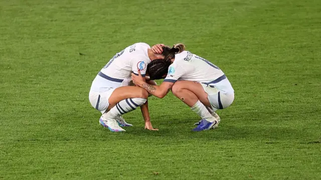 Viola Calligaris of Switzerland is consoled by team mate Geraldine Reuteler after Spain defeat Switzerland