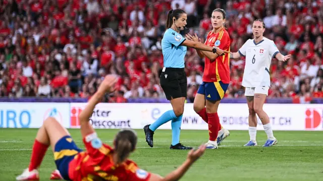 Italian referee Maria Sole Ferrieri Caputi shows the penalty spot