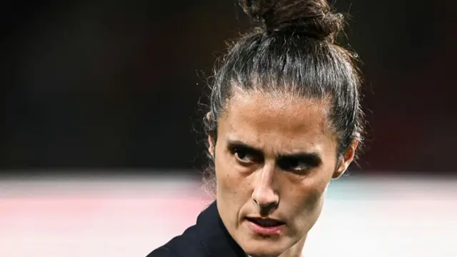 Spain's head coach Montse Tome looks down