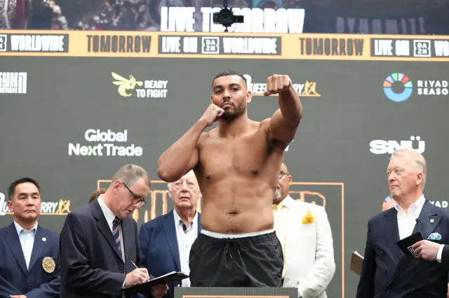 Solomon Dacres puts his fist out as he weighs in
