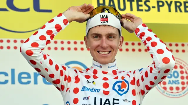 Tadej Pogacar in the polka dot jersey after winning stage 12 of the 2025 Tour de France