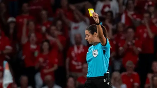 Laia Aleixandri of Spain (L) is given yellow card