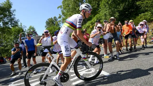 Tadej Pogacar climbing en route to victory on stage 12 of the 2025 Tour de France