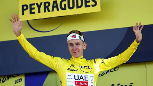 Tadej Pogacar on the podium after winning stage 13 of the 2025 Tour de France