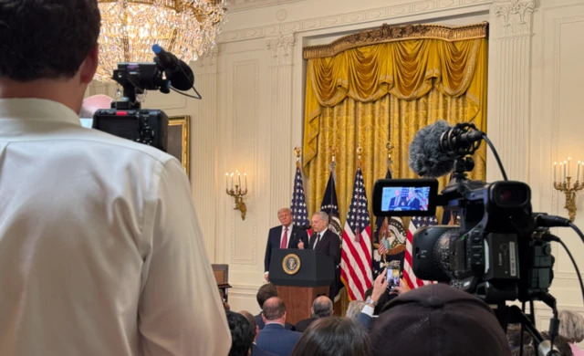 Trump speaking at news conference in White House.
