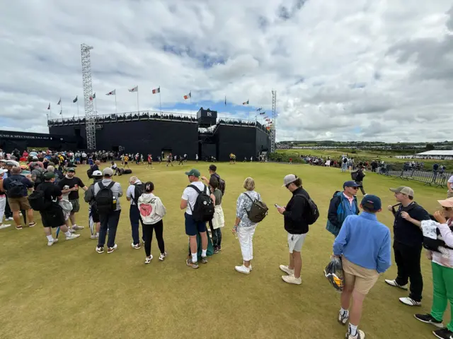 Queue at the 18th